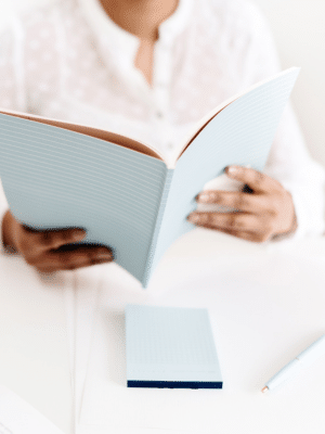 Virtual Assistant reading how to do their bookkeeping